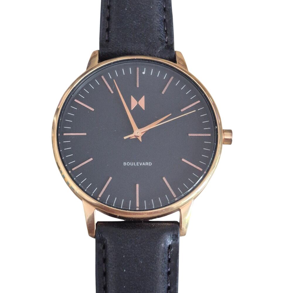 MVMT Mens Watch Black dial with gold trim matching band Corp core Great shape